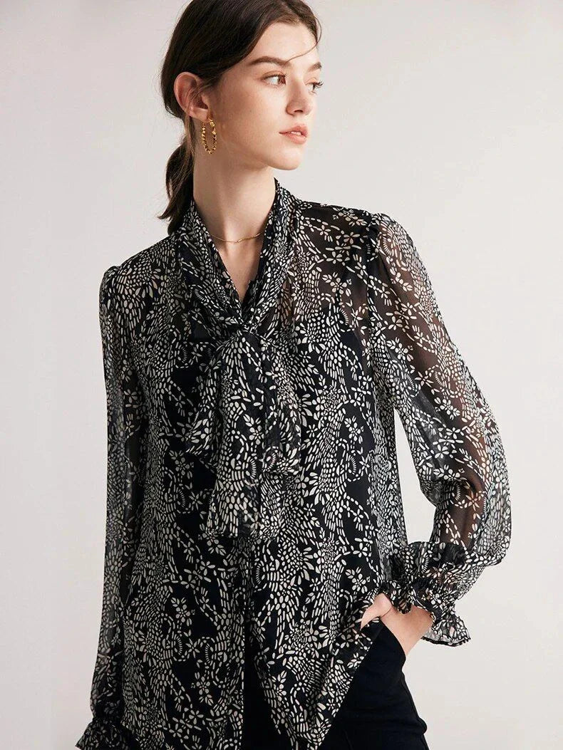 Elegant black silk blouse with unique bow collar, designed for a flattering fit and all-day comfort.