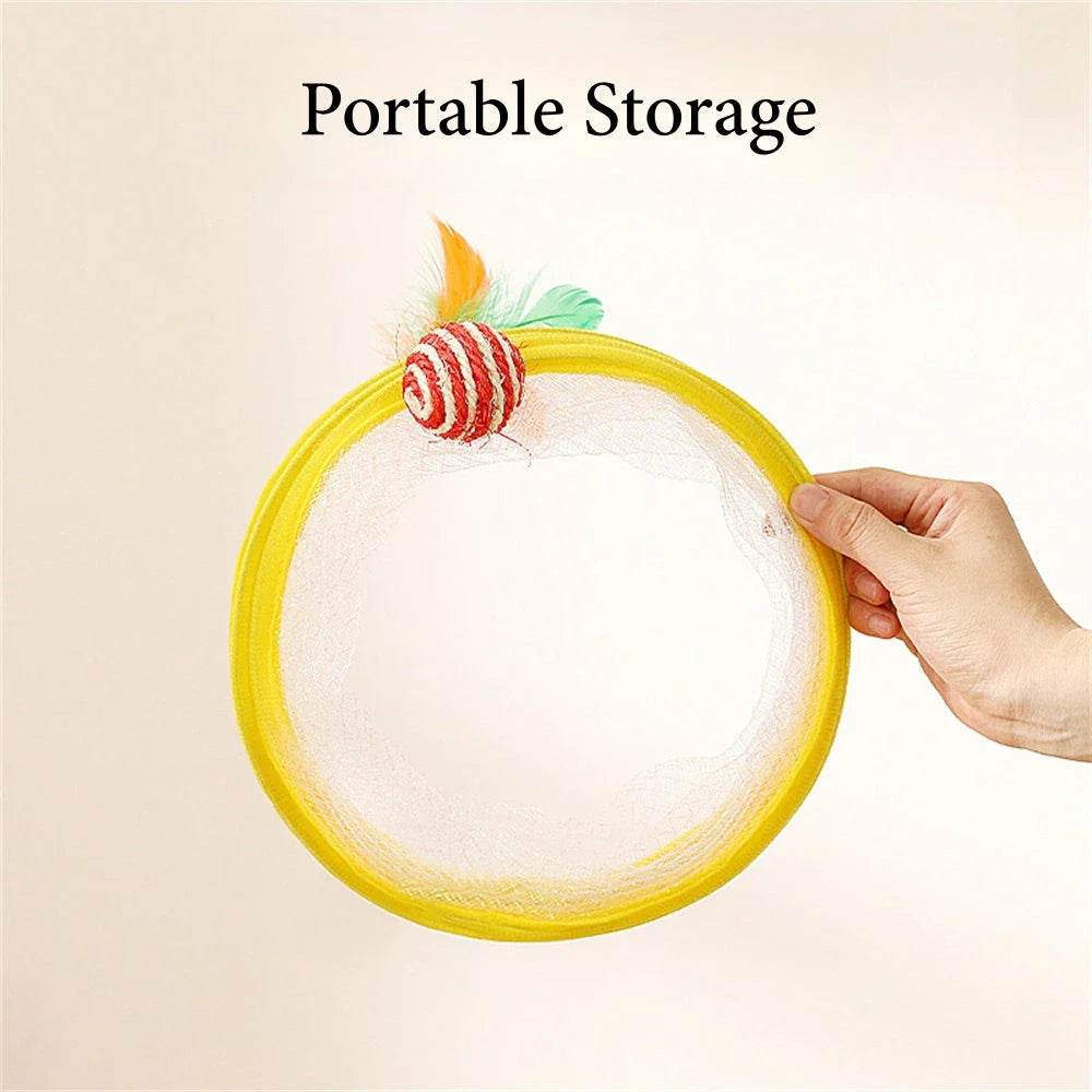 Folding cat play tunnel with various toys like balls, feathers, and mice attached to the sides
