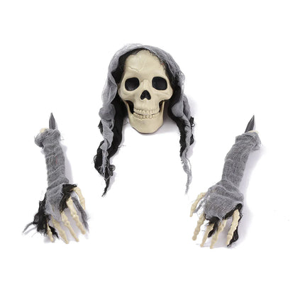 Three decorative plastic skull figures in green, red, and grey colours, perfect for Halloween home decor
