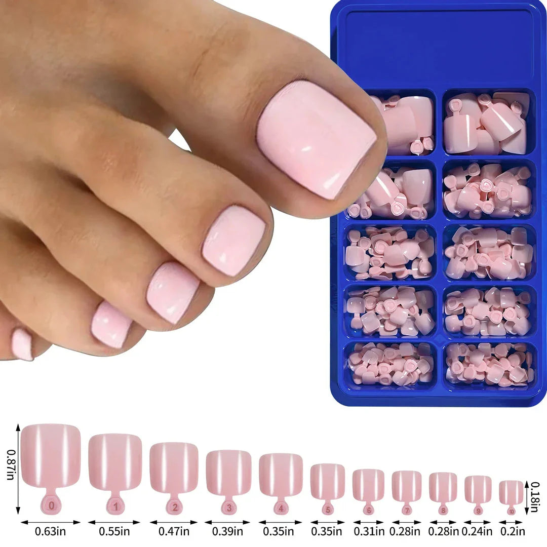Elegant short square press-on toenails in vibrant pink, red, and nude shades for a polished and convenient pedicure