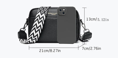 Stylish leather crossbody bag with embroidered strap in various colours