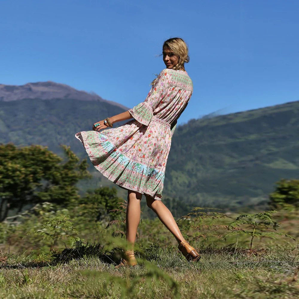 Elegant Bohemian-inspired pleated print dress in a vibrant pink colour, perfect for a day at the British seaside resort.