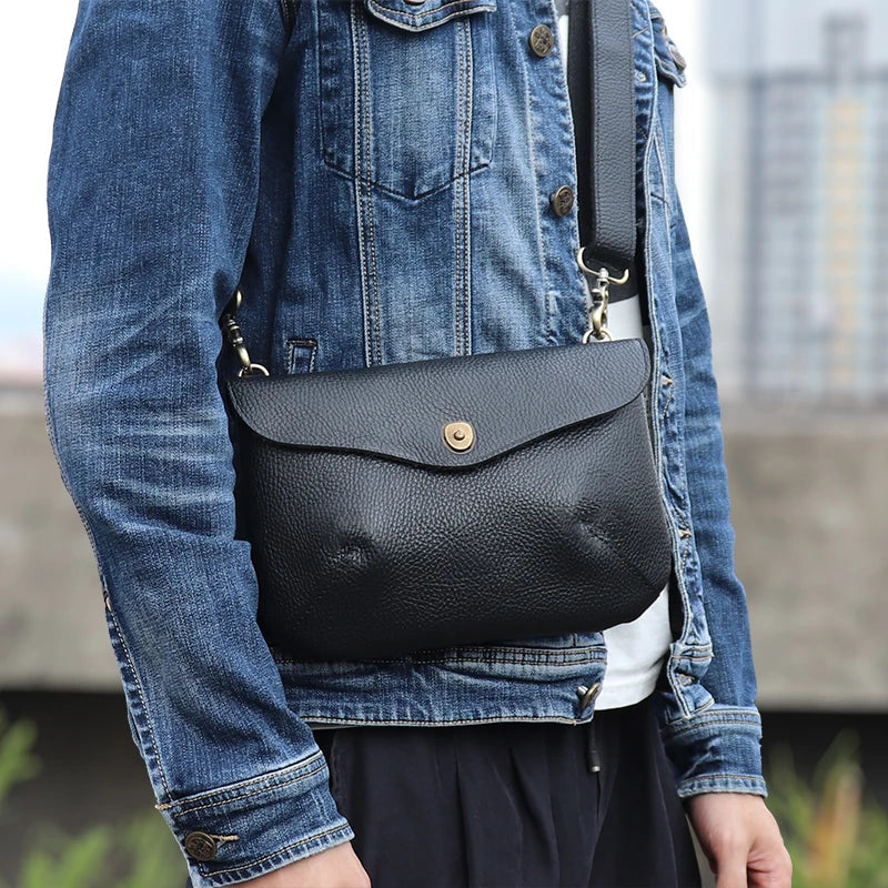 Premium handcrafted leather messenger bag in a classic British design, featuring a sturdy construction and spacious interior for the modern gentleman's everyday essentials.