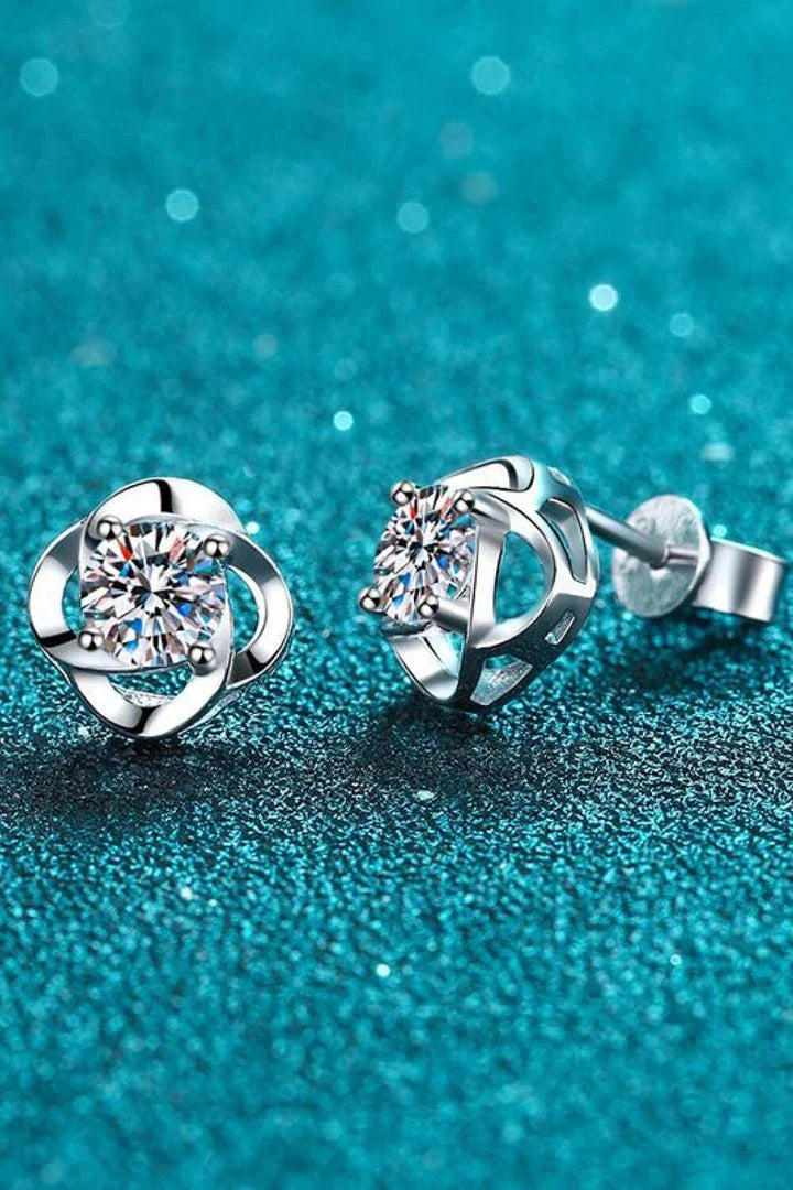 Pair of rhodium-plated moissanite stud earrings with a sleek, minimalist design
