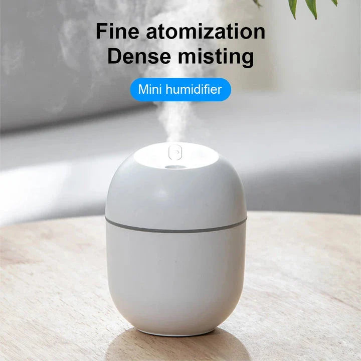 Compact ultrasonic humidifier and aroma diffuser with LED night lamp, available in white colour