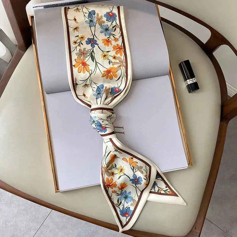 Elegant floral print polyester scarf with a soft, cotton-like texture for versatile seasonal wear