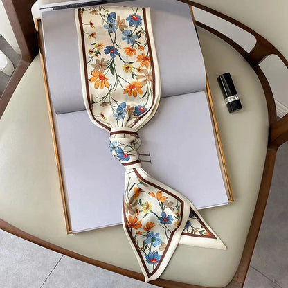 Elegant floral print polyester scarf with a soft, cotton-like texture for versatile seasonal wear