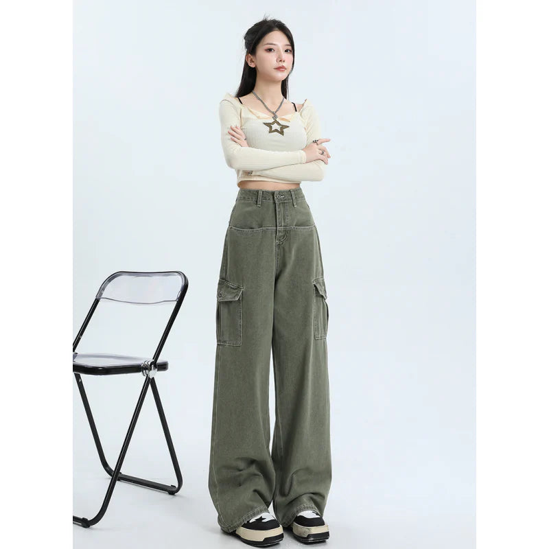 A pair of pink high-waist baggy jeans with a straight-leg design, featuring vintage-inspired details like buttons and faux zippers.