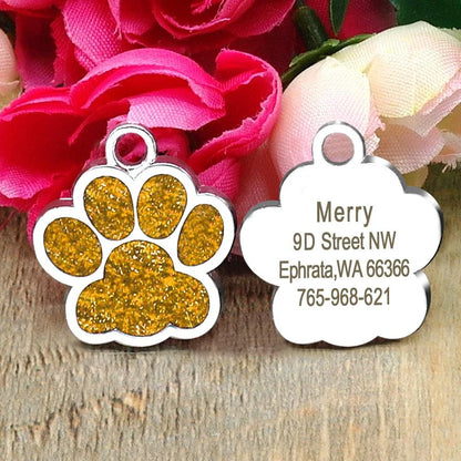 Paw-shaped pet ID tag with rhinestone embellishments, designed for safety and style