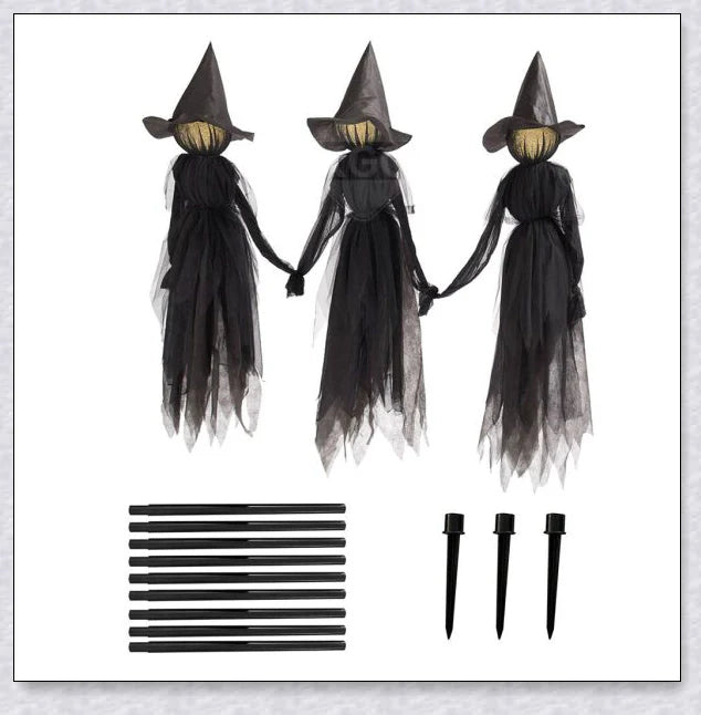 Three tall, black-robed witch figures with faceless glowing heads, standing together and holding hands, creating a spooky outdoor Halloween display