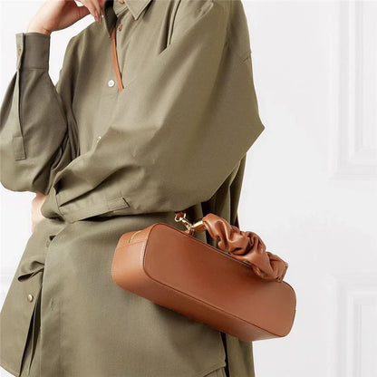Sophisticated long shoulder diagonal bag with a sleek horizontal square design, made of durable synthetic leather and featuring a single shoulder strap for hands-free convenience.