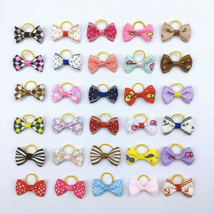Colourful pet hair bows in assorted colours, made with premium ribbon and rubber for a secure and comfortable fit.