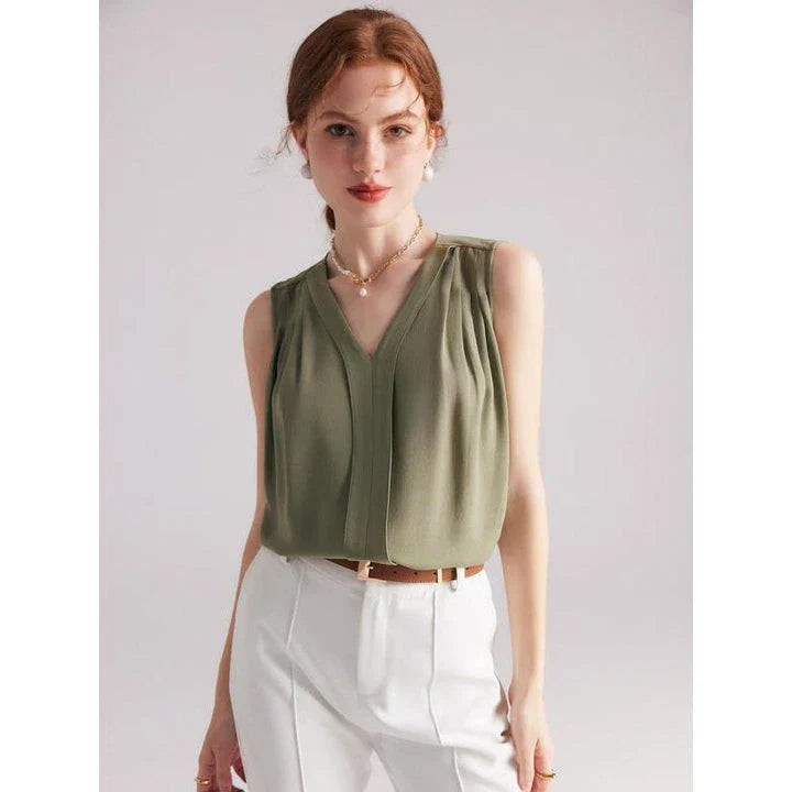Elegant sleeveless silk blouse in a vibrant blue colour, designed for a sophisticated summer style