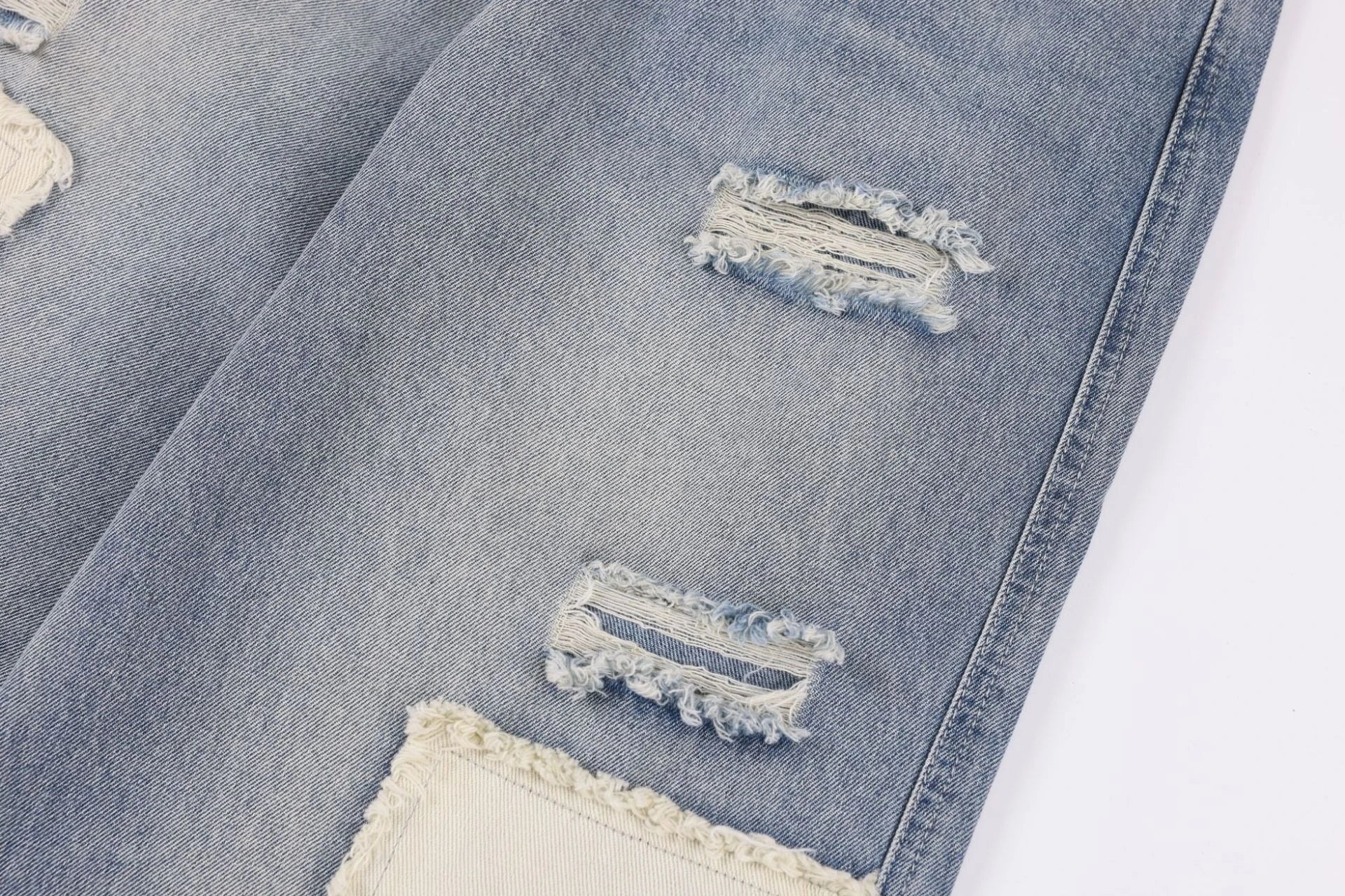 Premium heavy-duty straight-fit British denim jeans with distressed detailing and a versatile silhouette