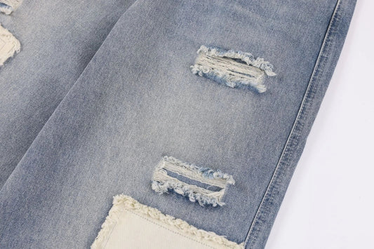 Premium heavy-duty straight-fit British denim jeans with distressed detailing and a versatile silhouette