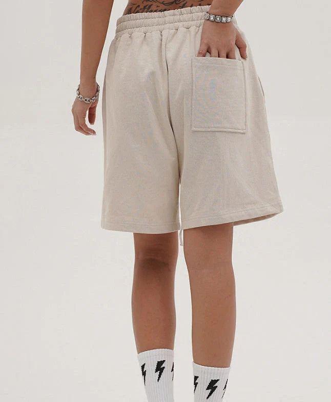 Premium loose-fit sports shorts with eye-catching printed patterns in black, khaki, and dark grey colours