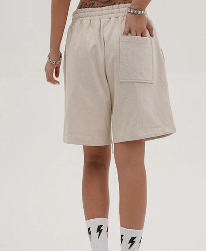 Premium loose-fit sports shorts with eye-catching printed patterns in black, khaki, and dark grey colours