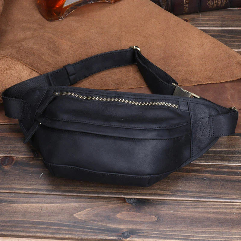 Premium British leather crossbody bag with adjustable strap and multiple pockets for organised storage