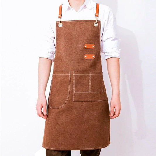Premium canvas barista apron with British-inspired design, perfect for protecting clothing while crafting coffee.