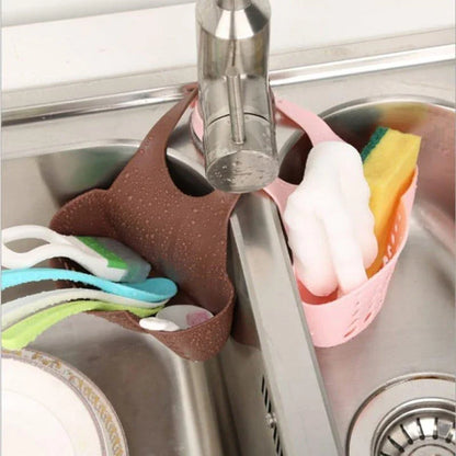 Adjustable stainless steel sink organiser rack with various colour options, designed to maximise kitchen sink space and keep essentials organised.