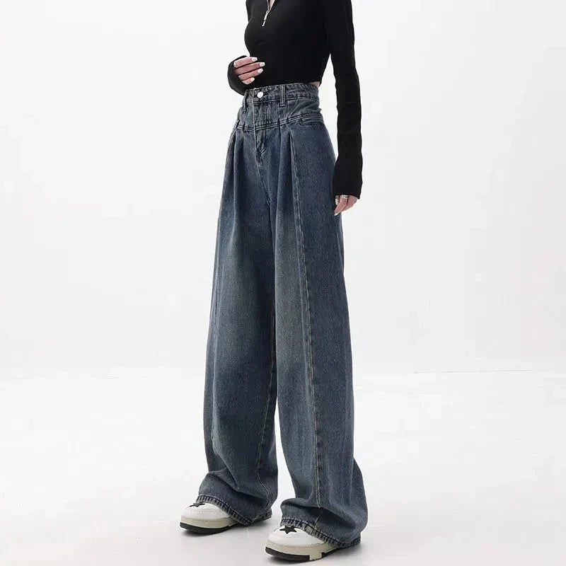 Relaxed fit wide-leg denim trousers in a classic blue colour, featuring a high-waisted design for a flattering fit.