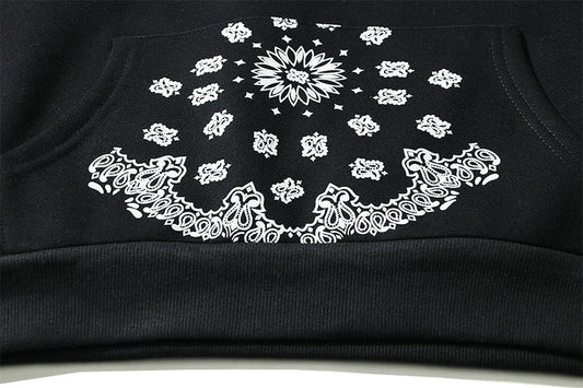 A cosy, fleece-lined hoodie with a classic paisley pattern, a relaxed fit, and practical side pockets for easy style and comfort.