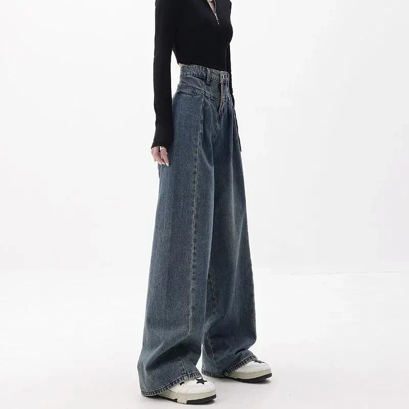 Relaxed fit wide-leg denim trousers in a classic blue colour, featuring a high-waisted design for a flattering fit.