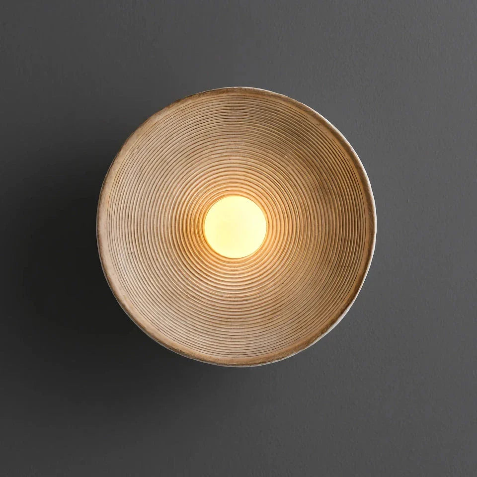 Elegant round wall light fixture with minimalist Wabi Sabi design, providing warm LED illumination for bedrooms and corridors