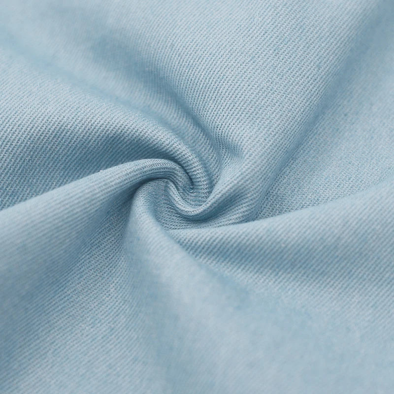 Relaxed-fit sports shorts in light blue and denim blue mosaic patterns, designed for casual everyday wear