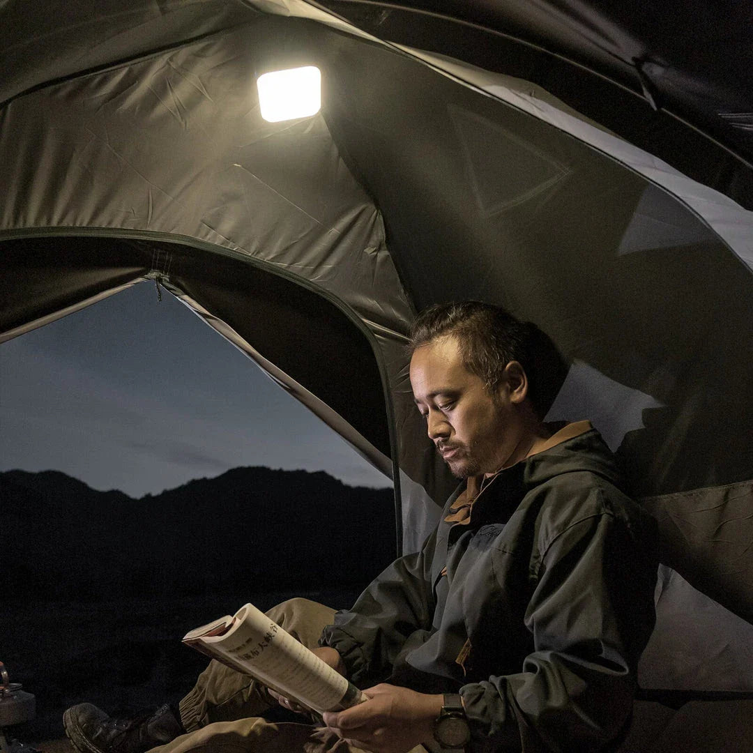 A versatile LED camping lantern with various lighting modes and a magnetic base, perfect for outdoor adventures and emergency situations.