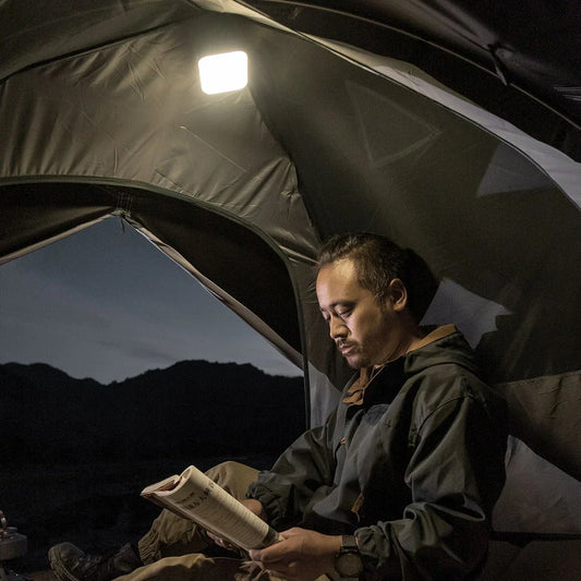 A versatile LED camping lantern with various lighting modes and a magnetic base, perfect for outdoor adventures and emergency situations.