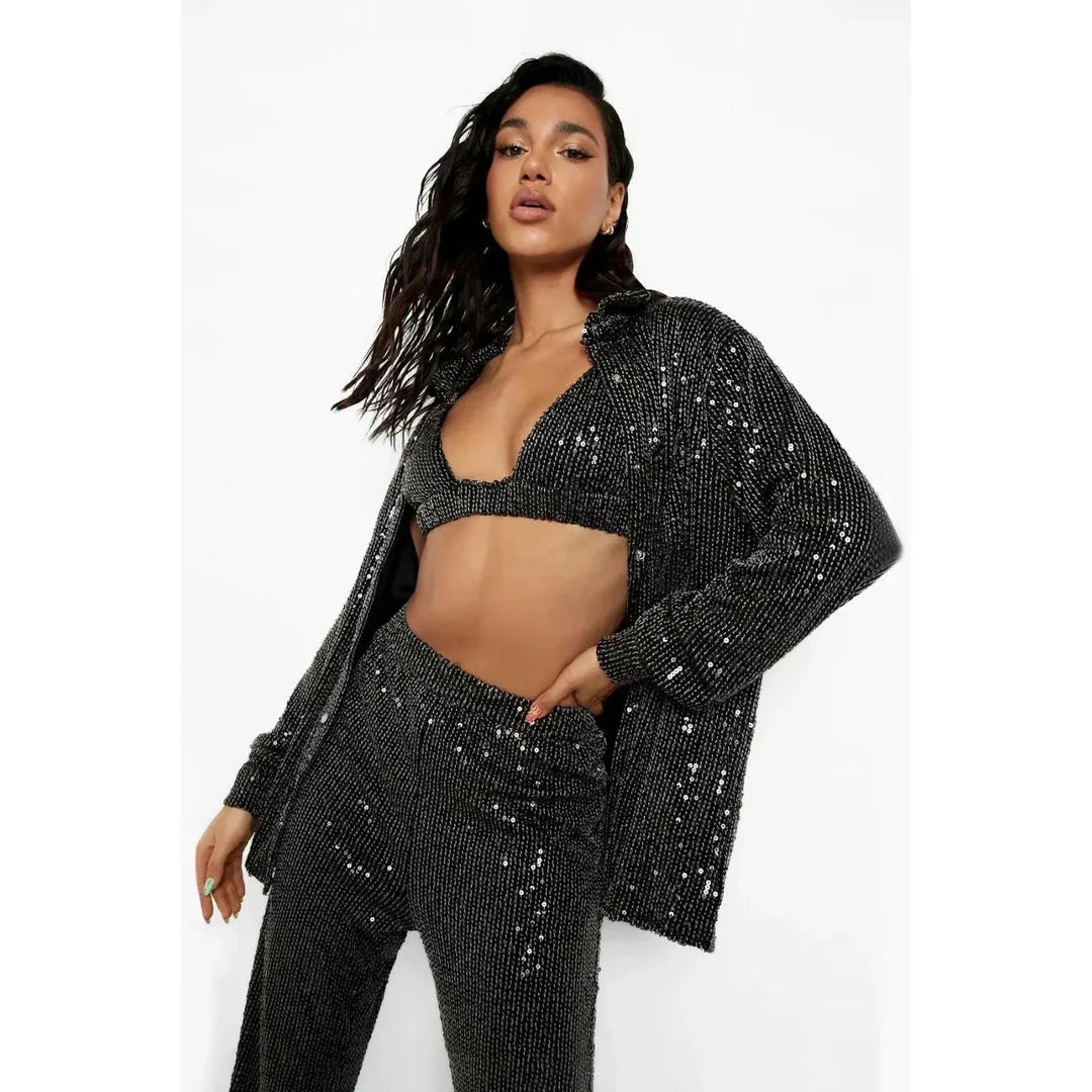 Elegant woman wearing a luxurious sequin top and pants set, perfect for a glamorous evening event