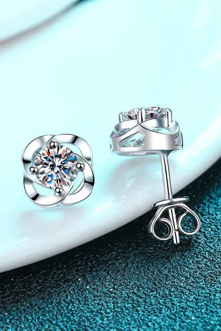 Pair of rhodium-plated moissanite stud earrings with a sleek, minimalist design