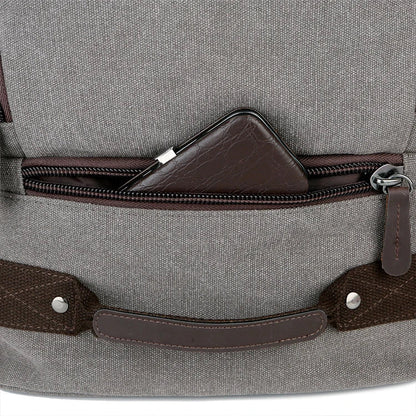 A classic messenger bag made of durable canvas with genuine leather trim, offering style and function for the modern British gentleman