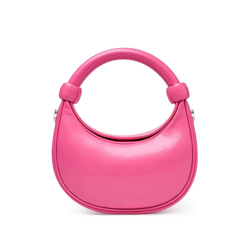 Elegant rose pink leather crescent-shaped crossbody bag with adjustable strap and zipper closure