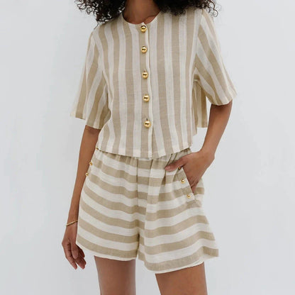 Relaxed and stylish two-piece summer outfit with a striped pattern, featuring a short-sleeved shirt and high-waist shorts.