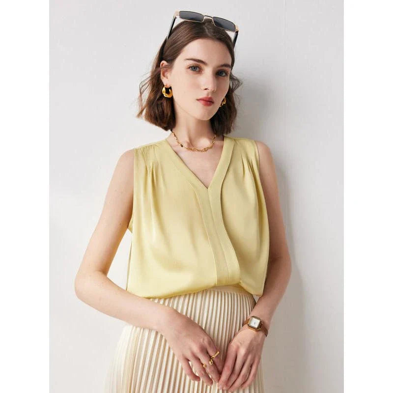 Elegant sleeveless silk blouse in a vibrant blue colour, designed for a sophisticated summer style