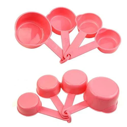 A set of 10 pink baking measurement cups and spoons made from food-grade plastic for precise ingredient measurements