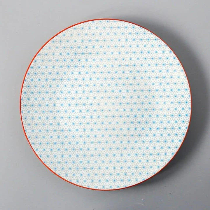 Elegant ceramic plates with vibrant, whimsical prints in a variety of enchanting designs