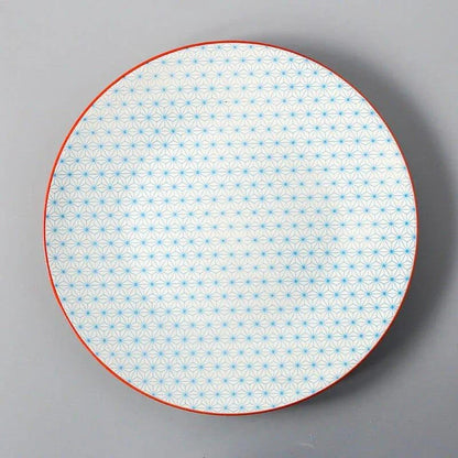 Elegant ceramic plates with vibrant, whimsical prints in a variety of enchanting designs