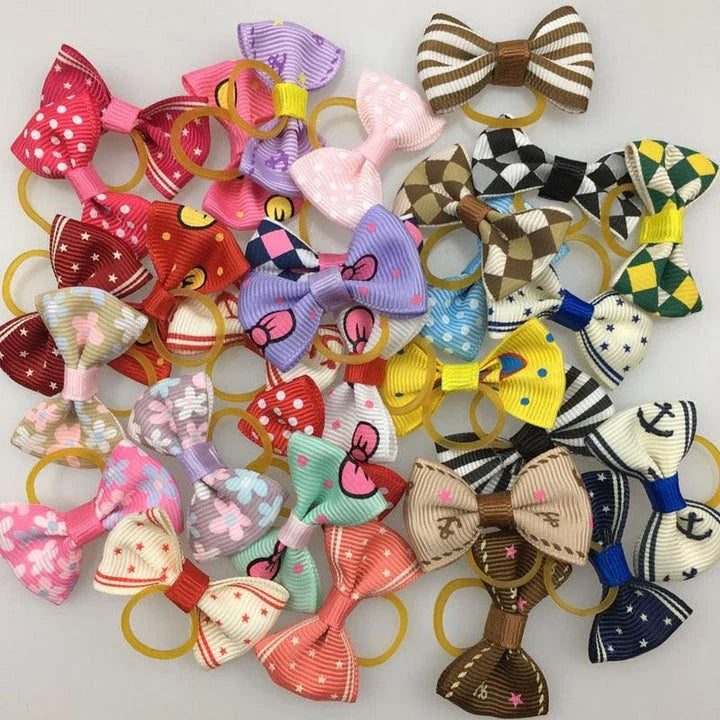 Colourful pet hair bows in assorted colours, made with premium ribbon and rubber for a secure and comfortable fit.