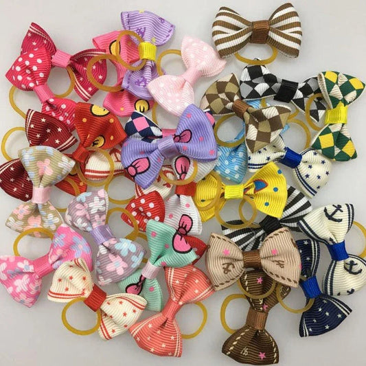Colourful pet hair bows in assorted colours, made with premium ribbon and rubber for a secure and comfortable fit.