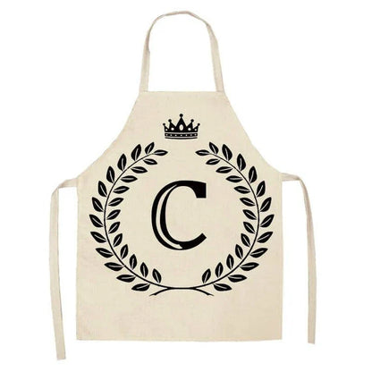 A high-quality kitchen apron featuring a charming crown and letter print design in a premium cotton and linen blend fabric.