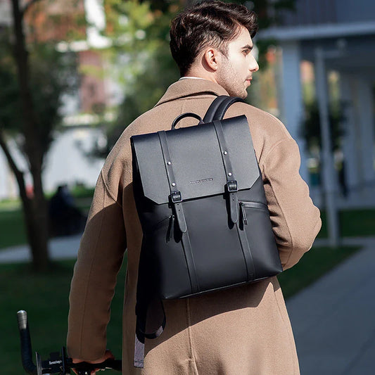 A stylish and functional large capacity backpack in black, featuring multiple pockets and a dedicated laptop compartment for school, travel, and work use.
