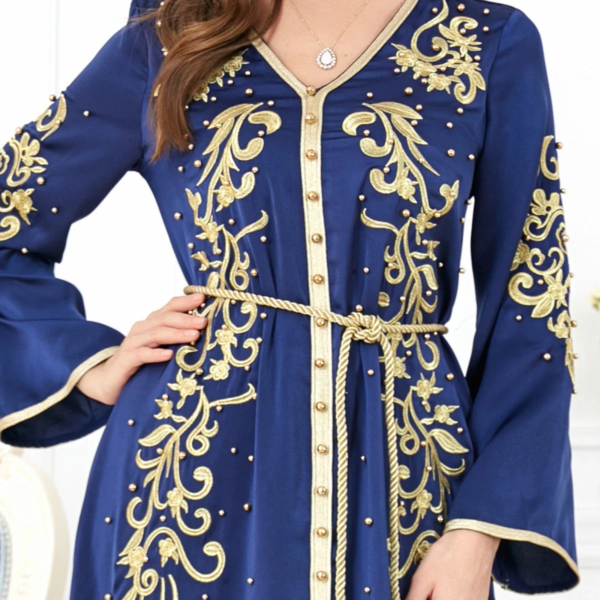 Elegant long-sleeve dress with floral embroidery in a sophisticated sapphire blue colour, suitable for British women