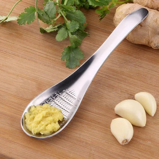 Premium stainless steel multi-purpose grater with ergonomic handle for easy grating and shredding in the modern British kitchen