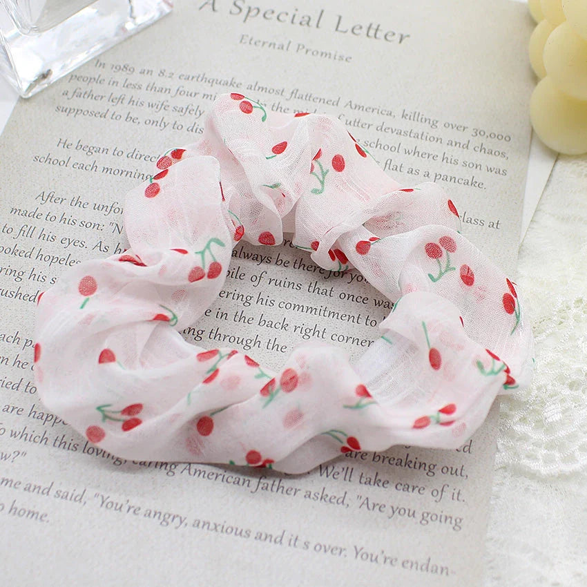 Handmade floral elastic hair bands with soft chiffon fabric and vibrant embroidered daisy patterns, perfect for enhancing everyday style in the UK.