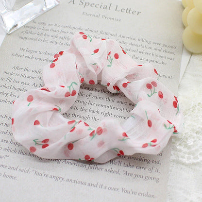 Handmade floral elastic hair bands with soft chiffon fabric and vibrant embroidered daisy patterns, perfect for enhancing everyday style in the UK.
