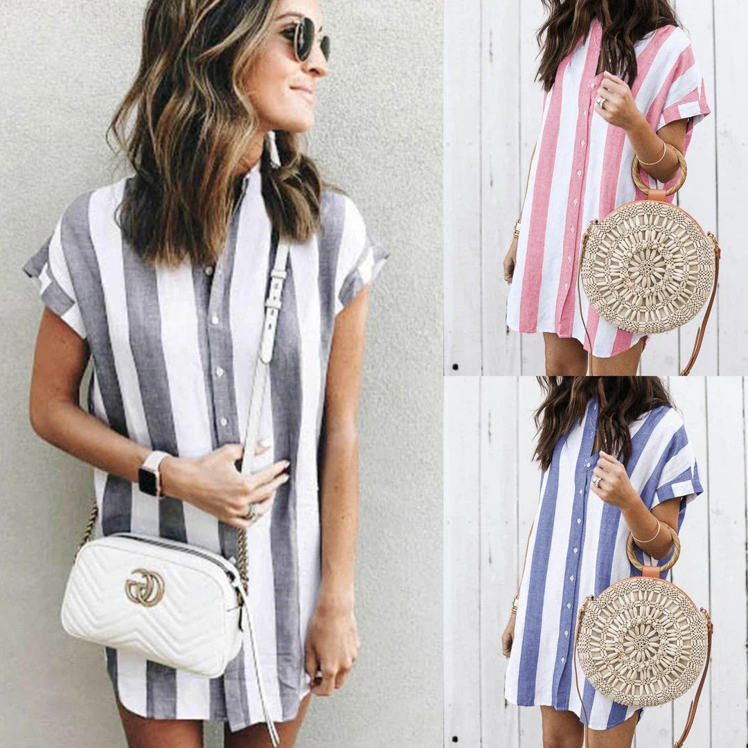 Casual striped short sleeve shirt dress in pink and blue colours, featuring a relaxed, flowing silhouette and button-down closure