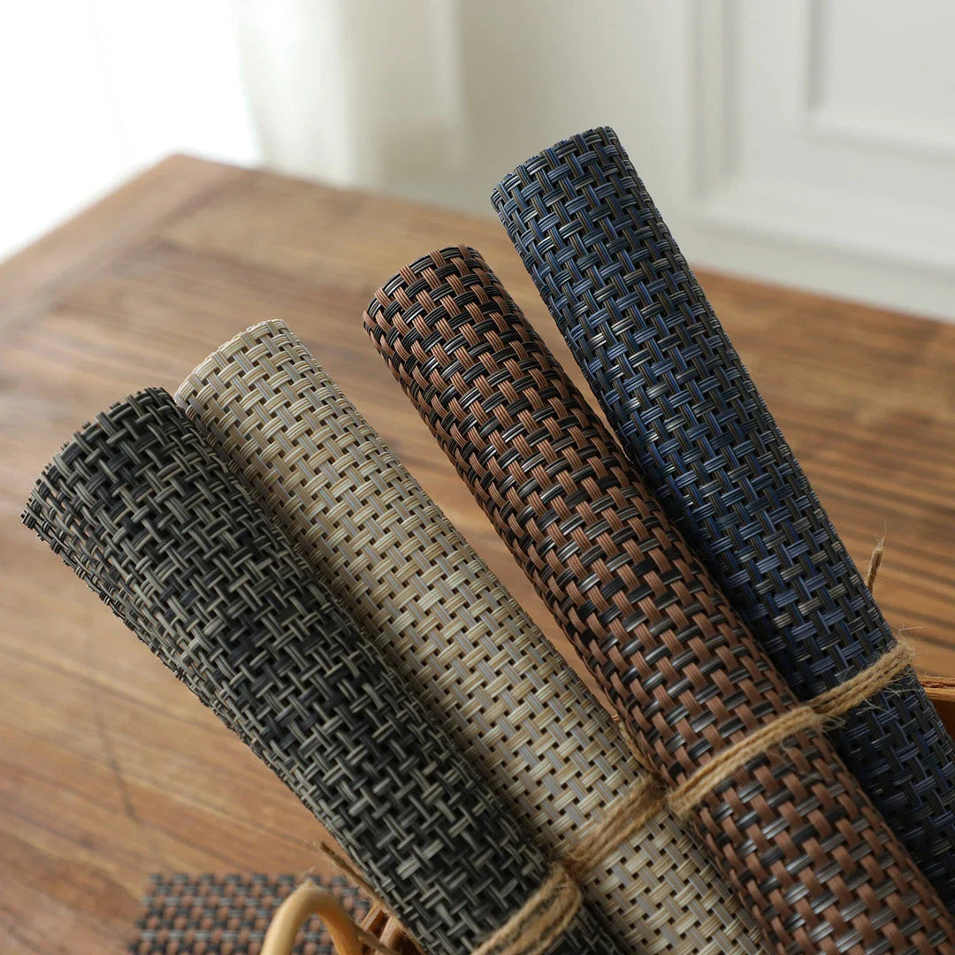 Stylish and durable waterproof placemats in black, protecting a dining table from spills and stains
